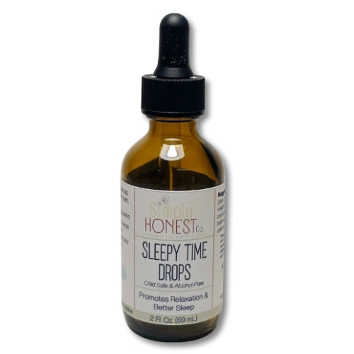 A brown glass bottle with a black dropper, containing a brown liquid labeled as "Sleeping Honest" sleep drops.
