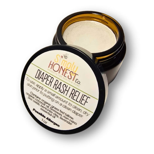 a jar of diaper rash relief cream with a black lid and a white label.