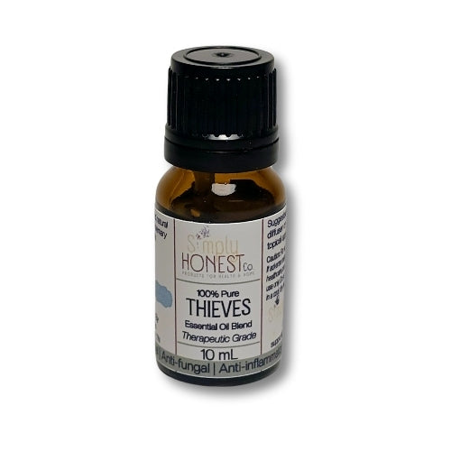 a bottle of thieves essential oil on a white background