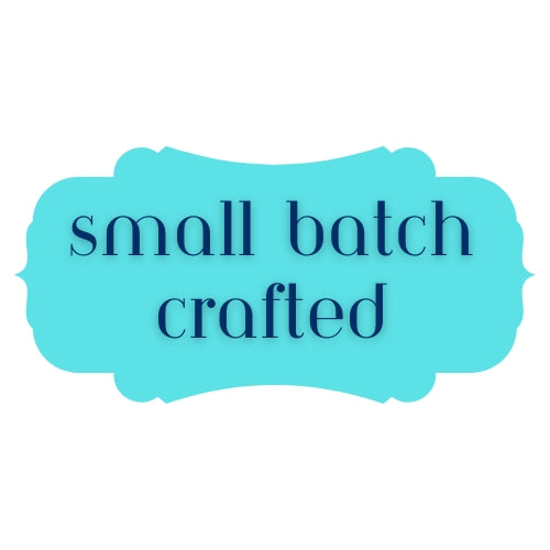 a blue rectangular frame with the text "small batch crafted" written in a simple, sans-serif font.
