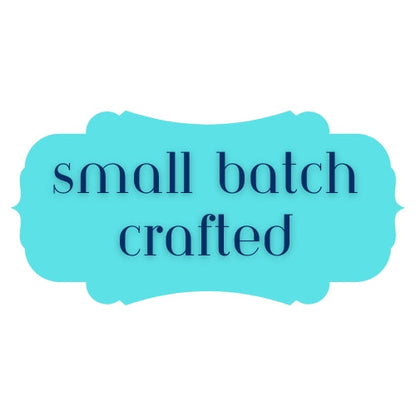 a blue rectangular frame with the text "small batch crafted" written in a simple, sans-serif font.