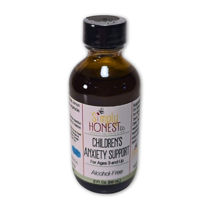 A bottle of children's anxiety support, labeled as alcohol-free, with a black cap and a white label.