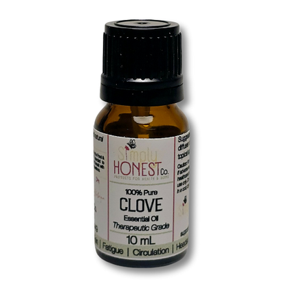 a bottle of clove essential oil on a white background